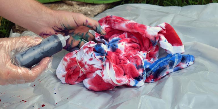 A shirt being tie-dyed