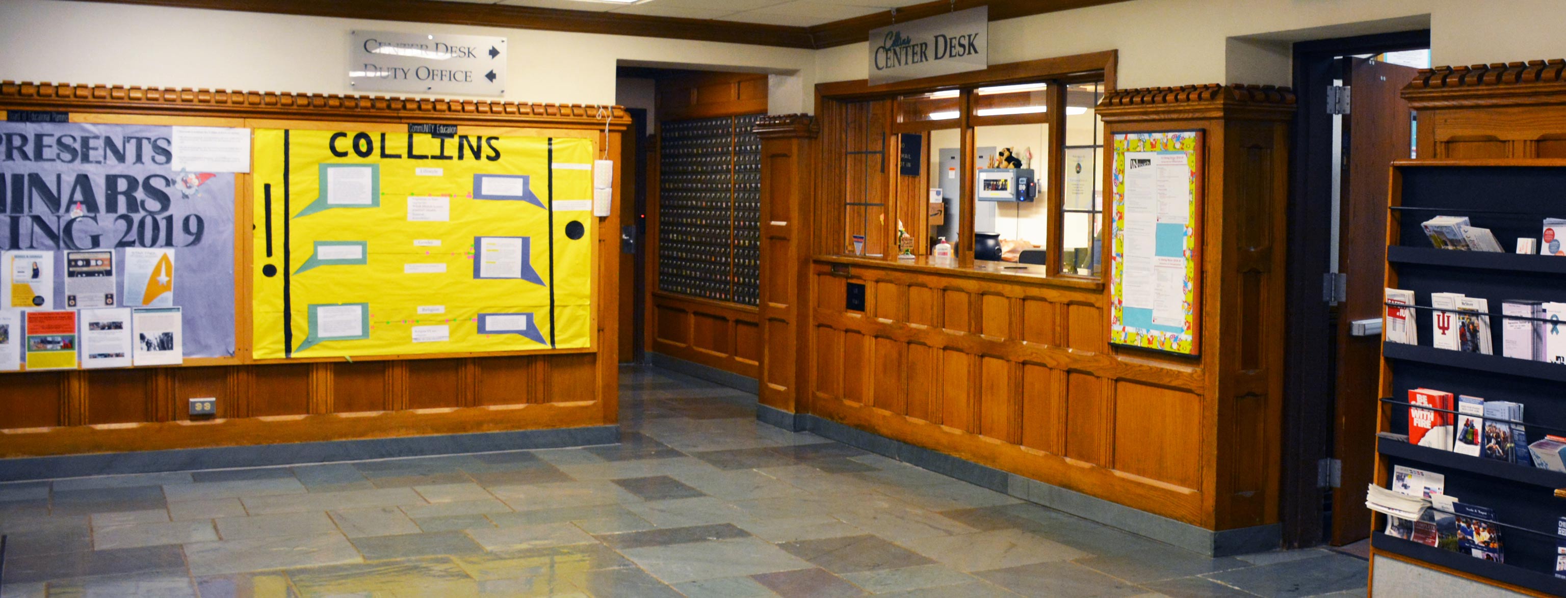 The lobby and center desk area of the Collins Living-Learning Center