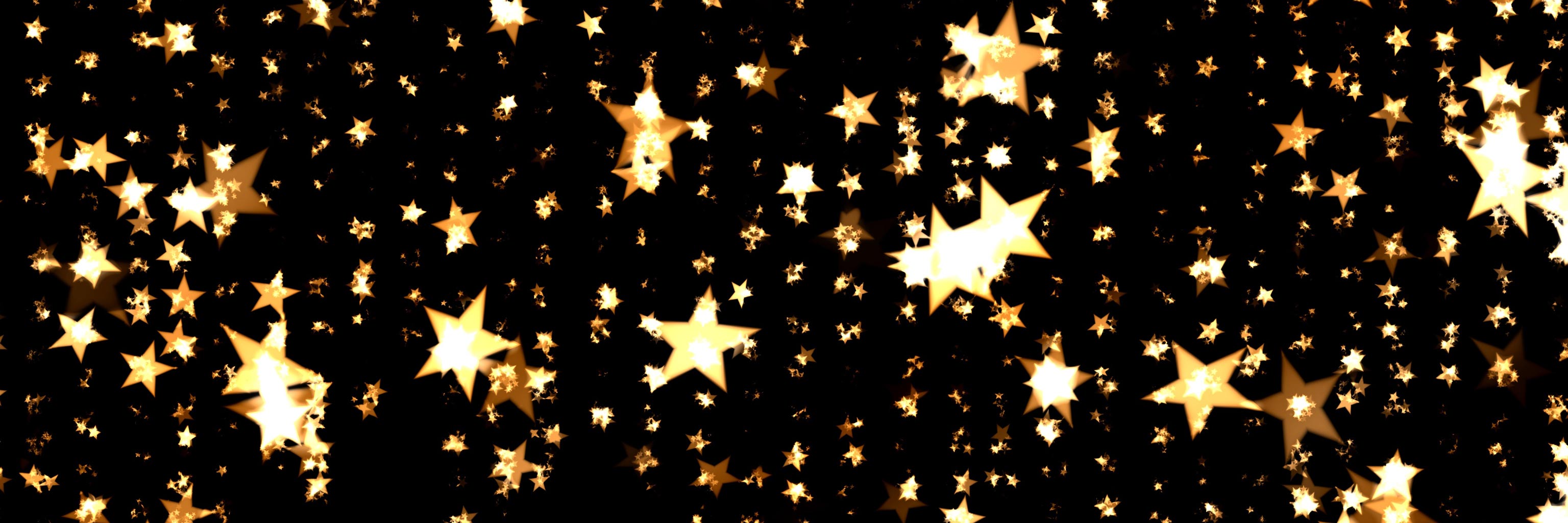 Many golden stars of various sizes