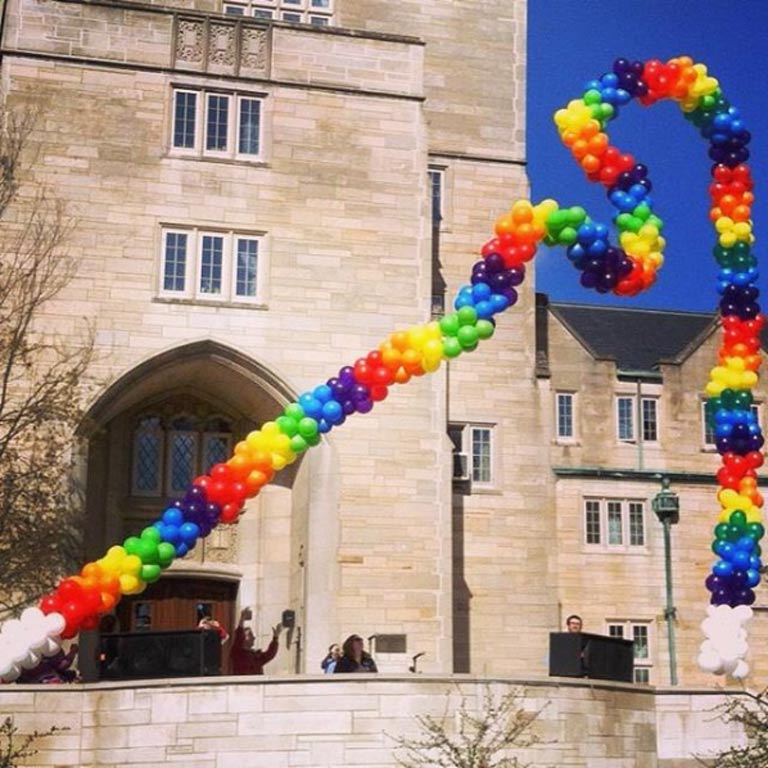 Massive rainbow balloon arch at the entrance to Collins Living-Learning Center
