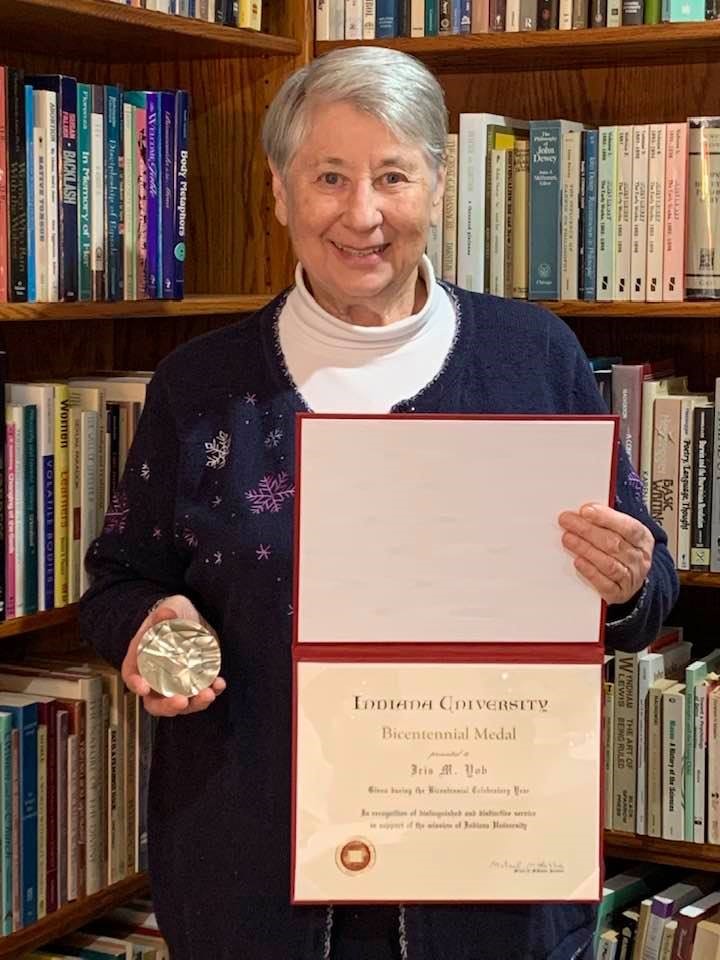 Iris Yob holding her Bicentennial Medal and Certificate